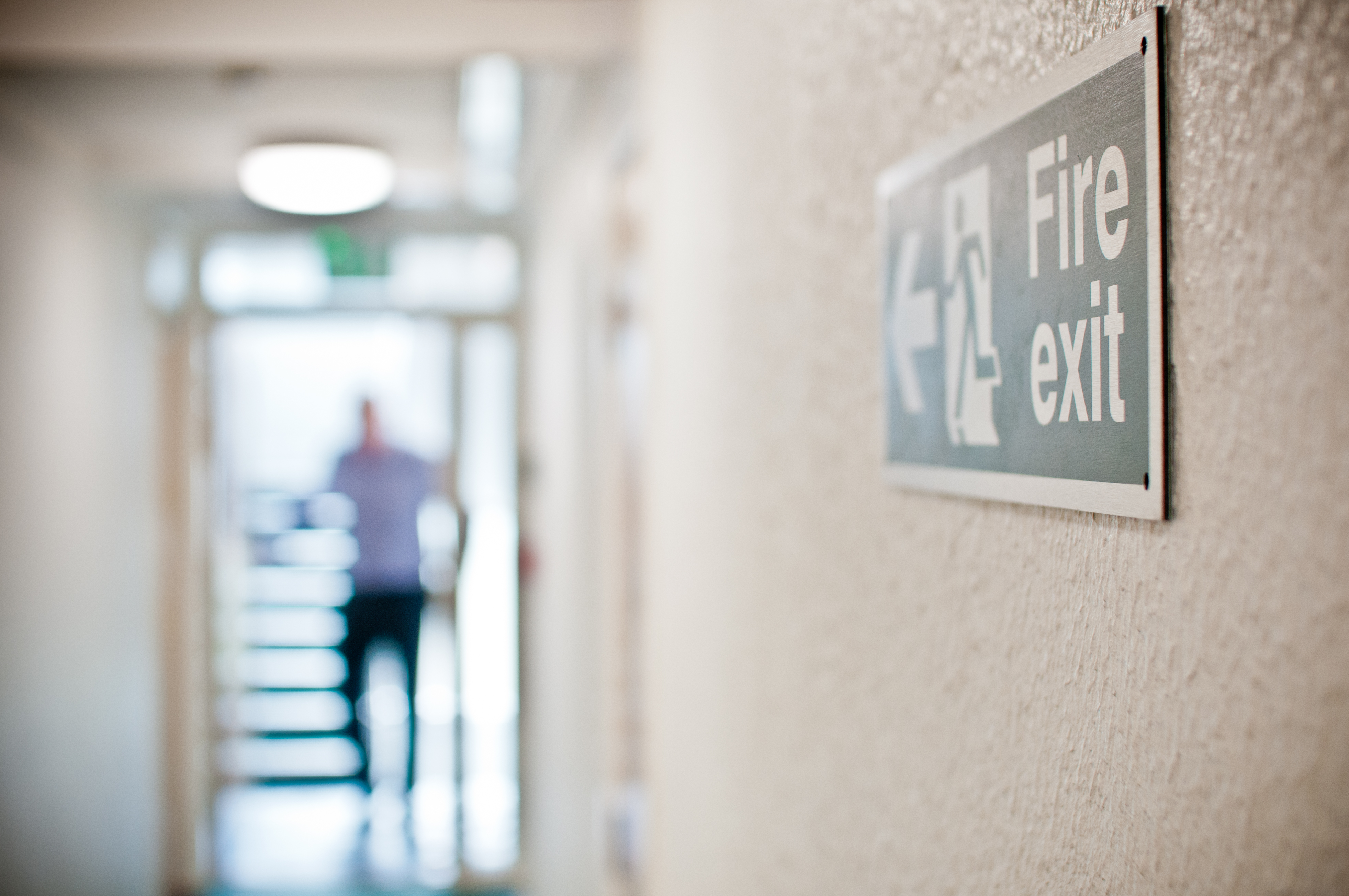 Person walking through a fire exit
