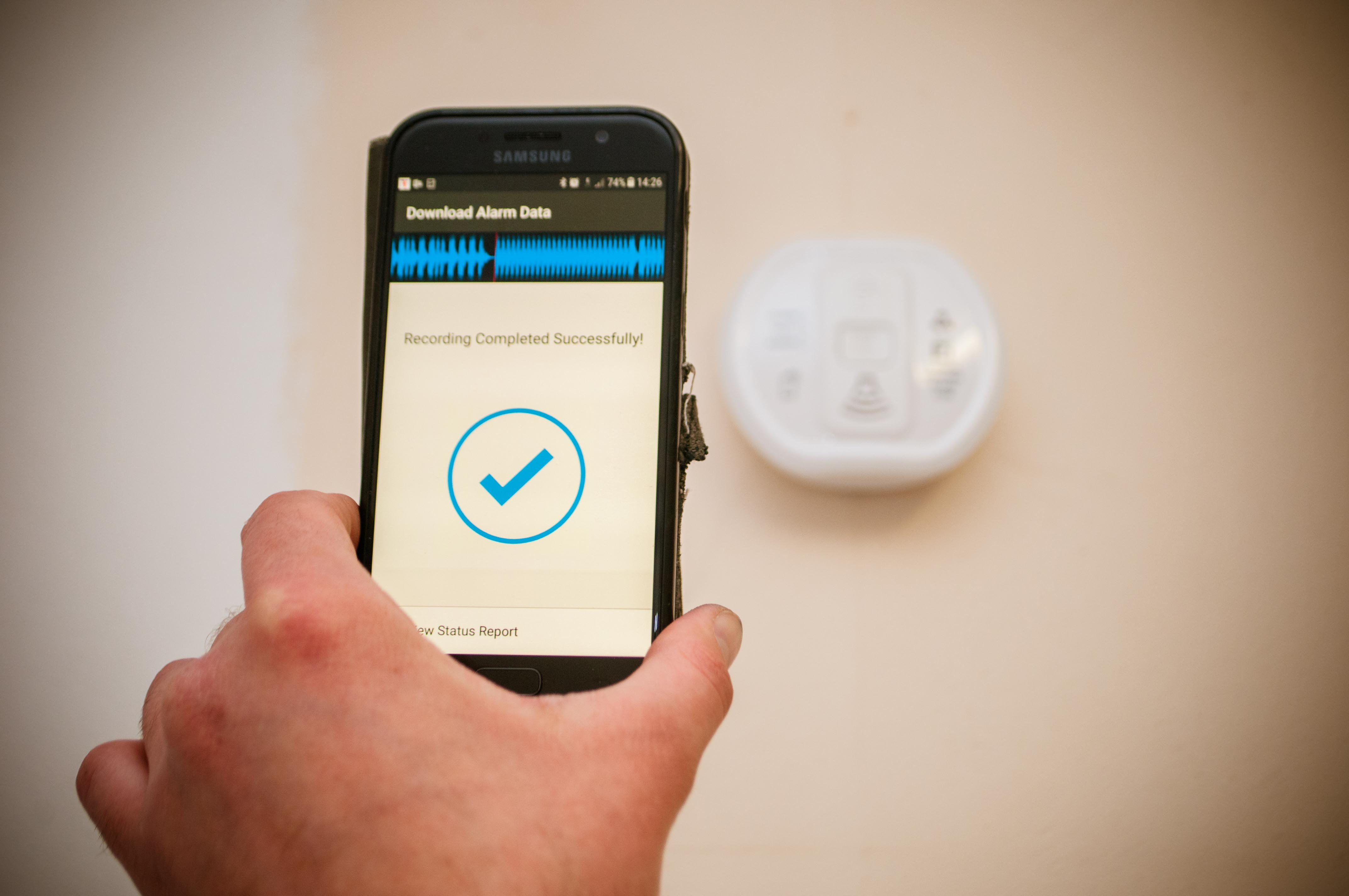 Carbon monoxide alarm being tested