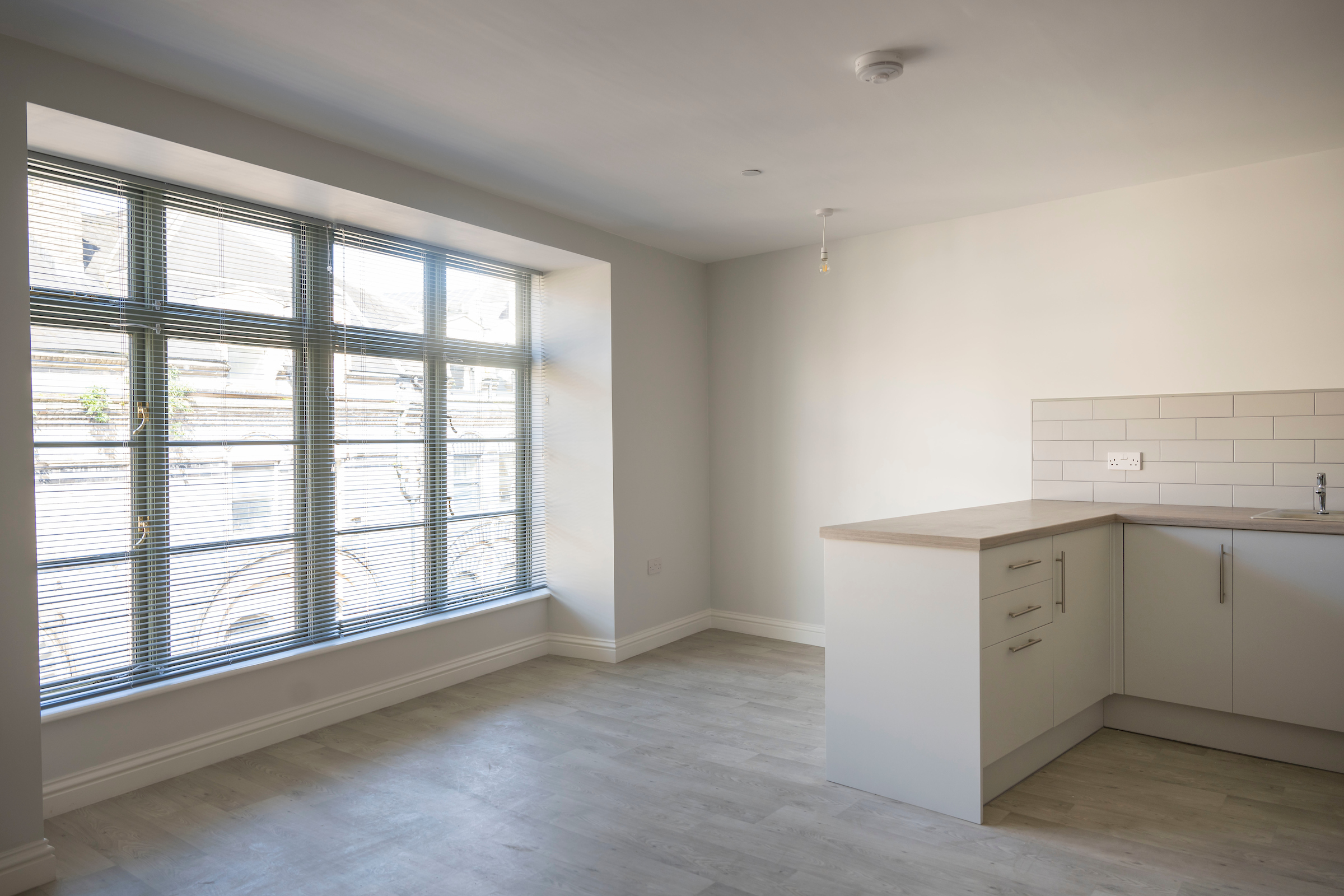 a new apartment with a large floor to ceiling window